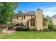 View of back exterior featuring a deck for outdoor dining, with lush lawn and mature landscaping at 2864 Wyndcliff Ct, Marietta, GA 30066