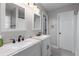 Bathroom featuring double sinks with a bright mirror and modern fixtures at 2864 Wyndcliff Ct, Marietta, GA 30066
