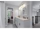 Hall bathroom with double sinks, quartz counters, and bright lighting at 2864 Wyndcliff Ct, Marietta, GA 30066