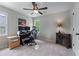 Comfortable bedroom with carpeted floors, a ceiling fan, and a well-lit workspace at 2864 Wyndcliff Ct, Marietta, GA 30066