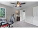 Bright bedroom with a workspace, carpeted floors, a ceiling fan, and natural light at 2864 Wyndcliff Ct, Marietta, GA 30066
