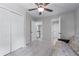 Bedroom with a large closet, carpeted floors, ceiling fan, and natural light from a window at 2864 Wyndcliff Ct, Marietta, GA 30066