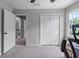 Cozy bedroom with carpeted floors, a double door closet, and natural light from the window at 2864 Wyndcliff Ct, Marietta, GA 30066