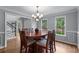 Open dining room with views to the entrance foyer and windows overlooking backyard landscaping at 2864 Wyndcliff Ct, Marietta, GA 30066