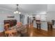 Bright dining room with hardwood floors, table and seating, leading to the kitchen and pantry at 2864 Wyndcliff Ct, Marietta, GA 30066