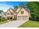 Stunning two-story home with meticulously maintained landscaping, a spacious driveway, and an attached garage at 2864 Wyndcliff Ct, Marietta, GA 30066