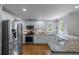 Modern kitchen featuring stainless steel appliances, granite countertops, and white cabinetry at 2864 Wyndcliff Ct, Marietta, GA 30066