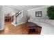 Cozy living room with hardwood flooring, neutral decor, and a view into the dining area at 2864 Wyndcliff Ct, Marietta, GA 30066