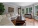 Bright living room features hardwood floors, a display cabinet and large windows at 2864 Wyndcliff Ct, Marietta, GA 30066