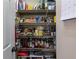 Pantry with organized shelving, filled with a variety of food items and household supplies at 2864 Wyndcliff Ct, Marietta, GA 30066