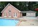 Community pool with wading pool and brick building showing a luxurious amenity for all residents at 2864 Wyndcliff Ct, Marietta, GA 30066