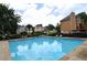 Community pool with clear blue water and lounge chairs showcasing a great amenity for residents to enjoy at 2864 Wyndcliff Ct, Marietta, GA 30066