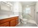 Updated bathroom features a walk-in shower, gray tile, and wood vanity at 4212 Worth Nw St, Acworth, GA 30101