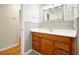 Bathroom featuring a wood vanity, large mirror, and tile flooring at 4212 Worth Nw St, Acworth, GA 30101