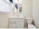 Bathroom with white vanity, mirror, and toilet at 4212 Worth Nw St, Acworth, GA 30101