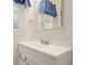 Bathroom vanity with white countertop, faucet, mirror, and blue curtain at 4212 Worth Nw St, Acworth, GA 30101
