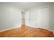 Bright bedroom with hardwood floors, closet, and doorway leading to another room at 4212 Worth Nw St, Acworth, GA 30101