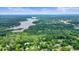 Aerial view of a beautiful lake surrounded by lush trees and homes, offering a serene setting at 4212 Worth Nw St, Acworth, GA 30101