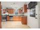Bright kitchen with stainless steel appliances, granite countertops, and light wood cabinets at 4212 Worth Nw St, Acworth, GA 30101