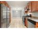 Modern kitchen featuring stainless steel appliances, light wood cabinets, tile floors and granite countertops at 4212 Worth Nw St, Acworth, GA 30101