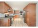Well-lit kitchen with stainless steel appliances, granite countertops and light wood cabinets at 4212 Worth Nw St, Acworth, GA 30101