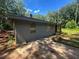 A view of the home's side showcasing the gray exterior, windows, and a portion of the property at 4601 Wilson James Sw Rd, Atlanta, GA 30331