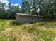 Rear exterior with gray siding and surrounded by nature at 4601 Wilson James Sw Rd, Atlanta, GA 30331