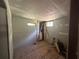 Interior view of an unfinished room with exposed insulation, studs, and a window at 4601 Wilson James Sw Rd, Atlanta, GA 30331
