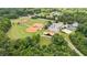Aerial image of the community ballpark features a view of the baseball fields, pavilion, and sports courts at 4972 Park Vale Dr, Sugar Hill, GA 30518