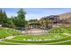 Picturesque outdoor amphitheater called The Bowl at Sugar Hill with manicured lawn seating at 4972 Park Vale Dr, Sugar Hill, GA 30518