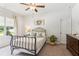 Bedroom featuring a bed, dresser, and window with natural light at 4972 Park Vale Dr, Sugar Hill, GA 30518