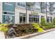 Attractive building with a water feature and landscaping featuring a Dr. Talk-able restaurant at 4972 Park Vale Dr, Sugar Hill, GA 30518