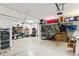 Spacious garage with ample storage, shelving, and room for multiple vehicles and equipment at 4972 Park Vale Dr, Sugar Hill, GA 30518