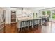 Spacious kitchen with stainless steel appliances, granite counters, and large center island with seating at 4972 Park Vale Dr, Sugar Hill, GA 30518