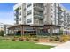 Exterior view of Panima Loca restaurant with covered patio, garden landscaping, and sidewalk at 4972 Park Vale Dr, Sugar Hill, GA 30518