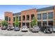 Charming brick-faced building features Rivermill Bakery and other retail businesses at 4972 Park Vale Dr, Sugar Hill, GA 30518