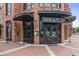 The inviting facade of Shine Pizza, enhanced by brickwork and industrial-style awnings at 4972 Park Vale Dr, Sugar Hill, GA 30518