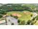 Comprehensive aerial view showing a park with baseball fields, tennis courts and recreational areas at 4972 Park Vale Dr, Sugar Hill, GA 30518