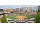 Overhead view of the town center featuring an amphitheater, fountains, and surrounding buildings at 4972 Park Vale Dr, Sugar Hill, GA 30518
