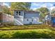 View of the home's backyard featuring a well-maintained lawn and the home's exterior at 1270 Graymont Sw Dr, Atlanta, GA 30310