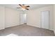 Light filled bedroom with neutral tones, carpet, and ceiling fan at 1270 Graymont Sw Dr, Atlanta, GA 30310