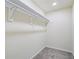 Simple, empty closet featuring a hanging rod and neutral walls at 1270 Graymont Sw Dr, Atlanta, GA 30310
