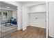 Open closet reveals shelves and hooks with hardwood floors leading to a cozy living space at 1270 Graymont Sw Dr, Atlanta, GA 30310