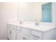 Bathroom vanity featuring double sinks, sleek hardware, and ample storage space at 1648 Florence Nw Run, Atlanta, GA 30318