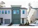 Charming two-story townhouse with a green front door and garage at 1648 Florence Nw Run, Atlanta, GA 30318