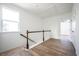 Bright hallway with hardwood floors, staircase, and natural light at 1648 Florence Nw Run, Atlanta, GA 30318