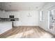 Modern kitchen with white cabinets, island, and stainless steel appliances at 1648 Florence Nw Run, Atlanta, GA 30318