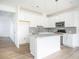 Modern kitchen with white cabinets, gray backsplash, and stainless steel appliances at 1648 Florence Nw Run, Atlanta, GA 30318