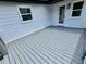 Back deck with gray wood, white siding, and black trim; great outdoor space at 1937 Don Juan Ln, Decatur, GA 30032