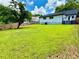 Expansive backyard view showcasing the home's exterior and large lawn at 1937 Don Juan Ln, Decatur, GA 30032